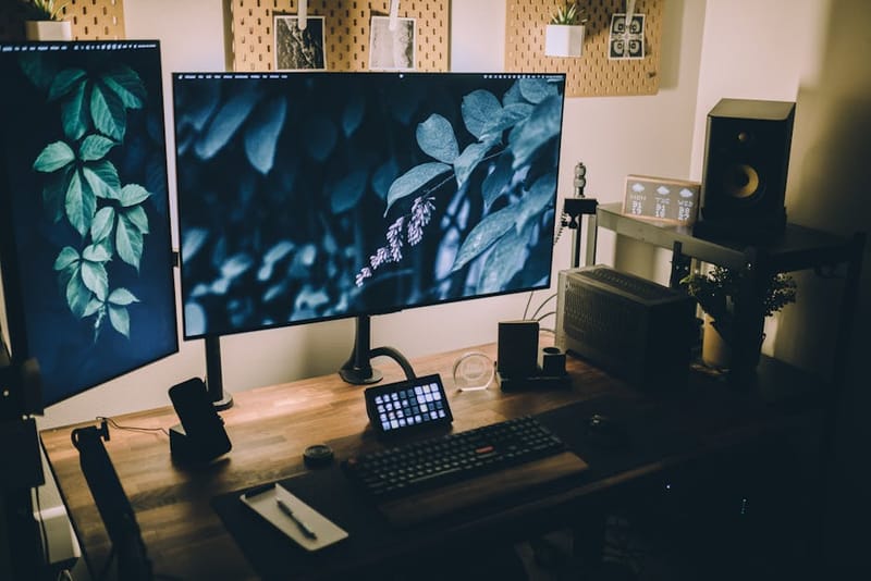 A tidy home-office desk with a laptop, notebook and coffee mug - illustrating the Easy-Going Nerd editorial workspace
