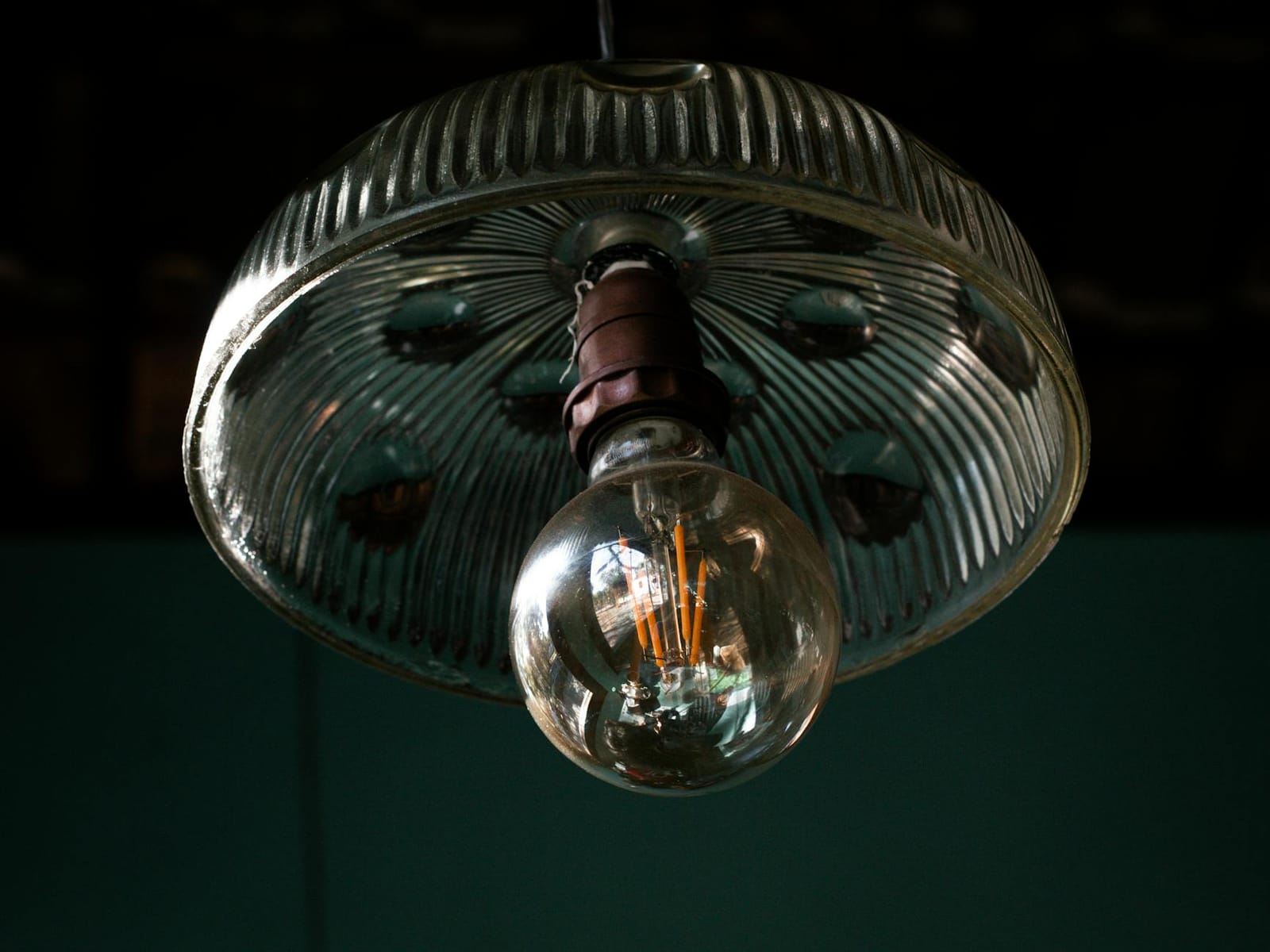 Colour-changing smart bulb glowing in a lamp