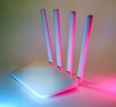 Tri-band Wi-Fi 7 mesh router on a shelf